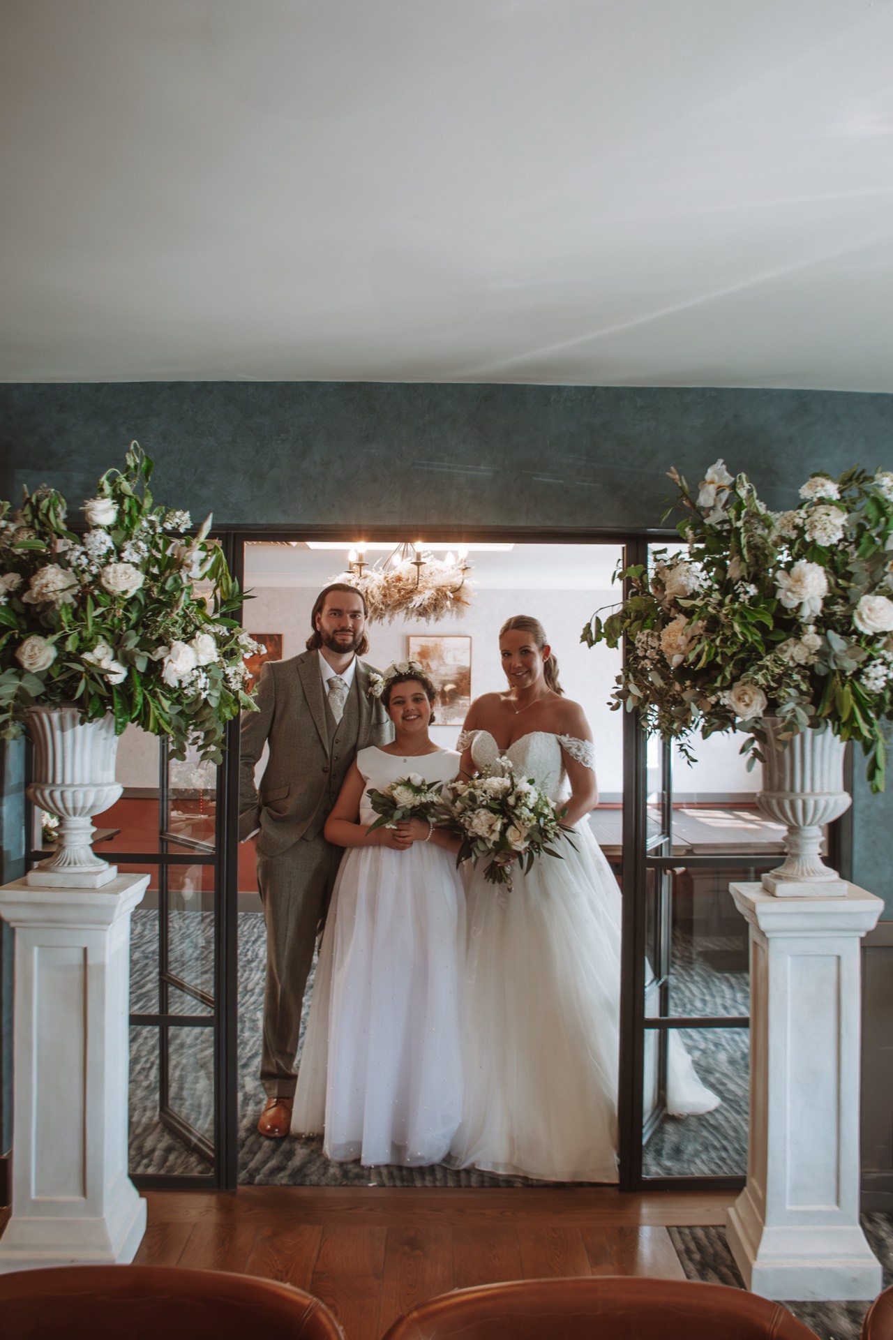 A bride, groom and bridesmaid at Mason's