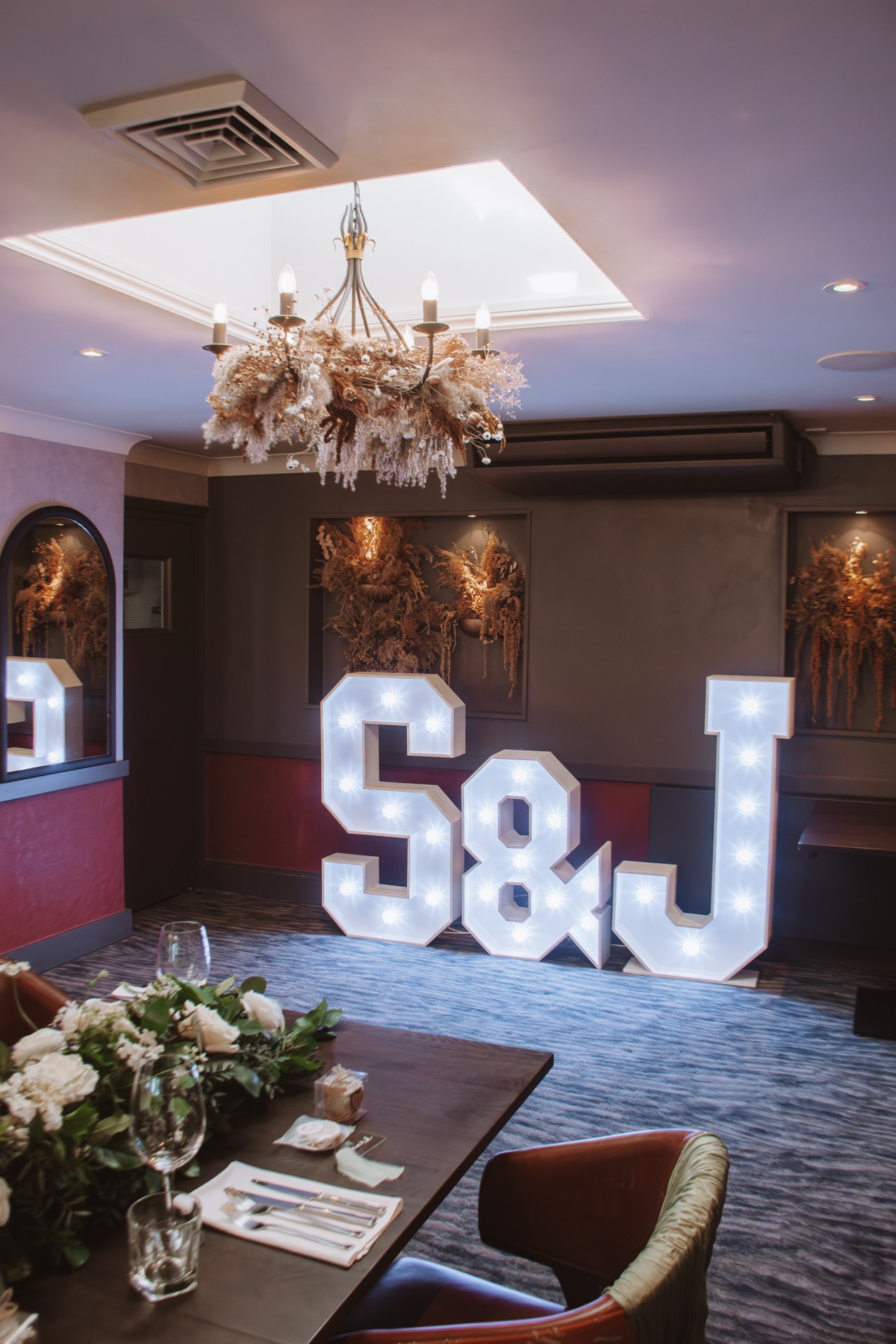 Illuminated letters at a wedding reception