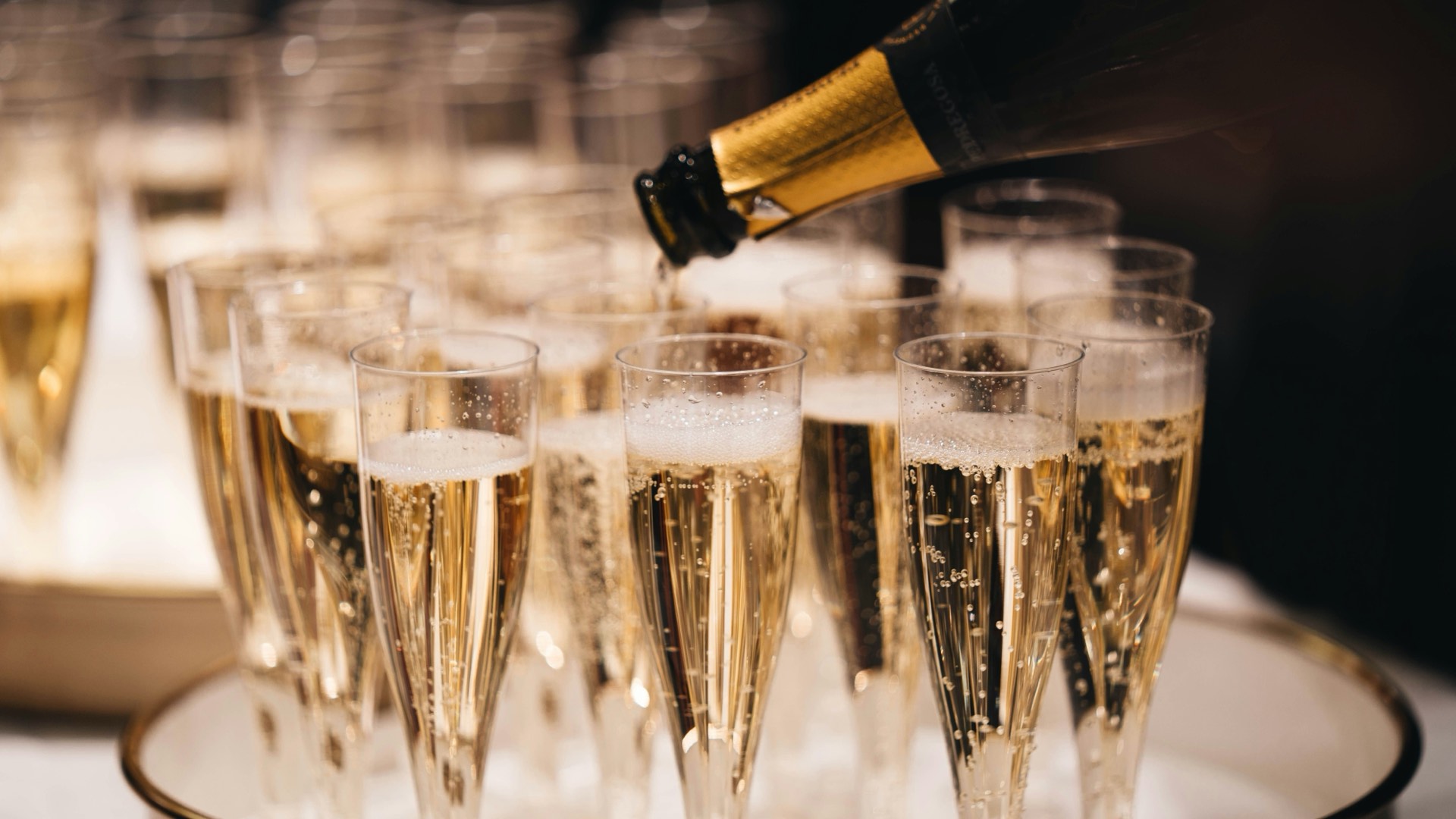 Champagne glasses raised in celebration at Mason's