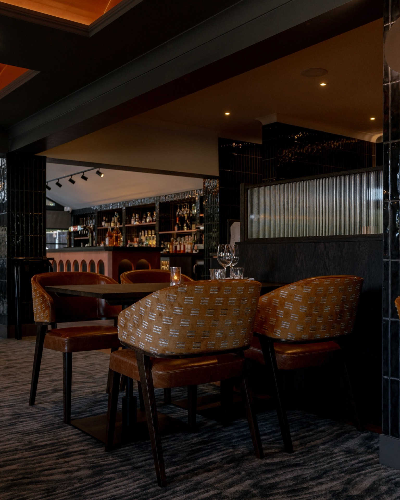 Brown chairs beside the bar