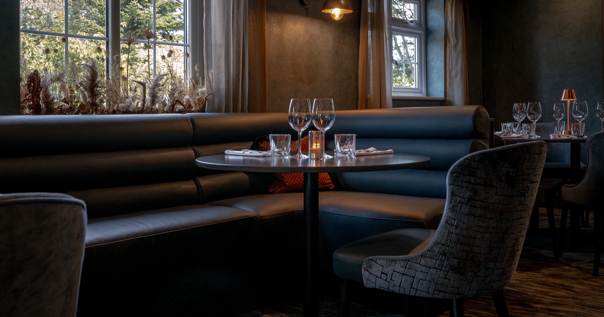 Tables set beside the windows at Mason's