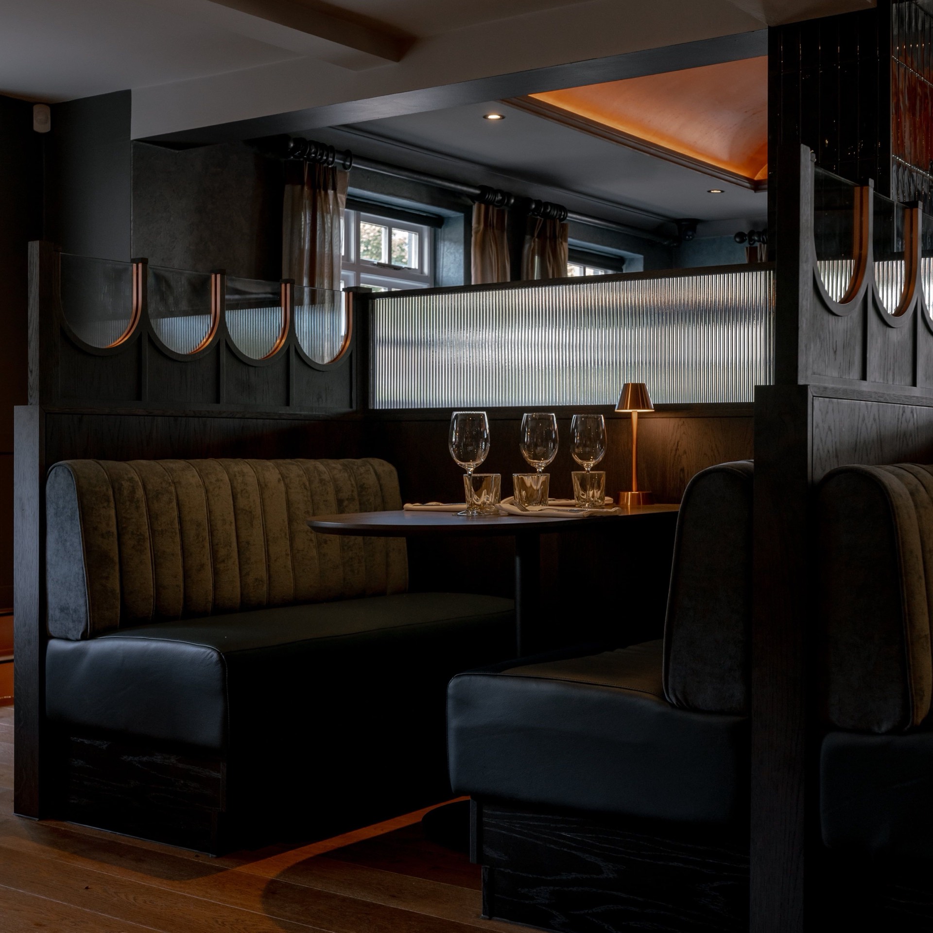 A candlelit booth set for dinner at Mason's Restaurant