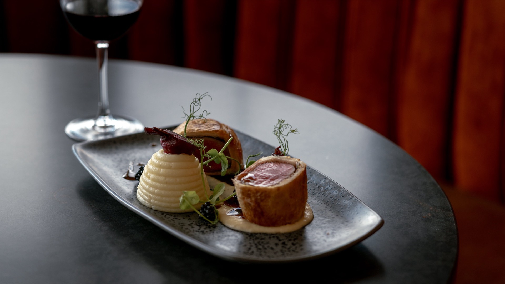 A gourmet plated Christmas meal with wine at Mason's