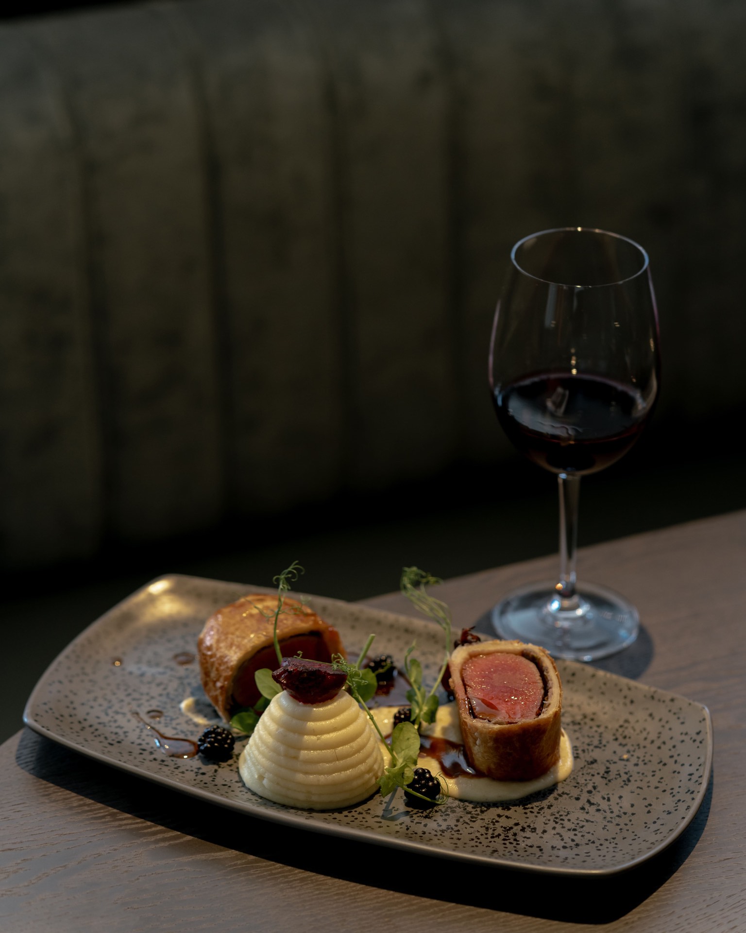 Beef Wellington served with wine