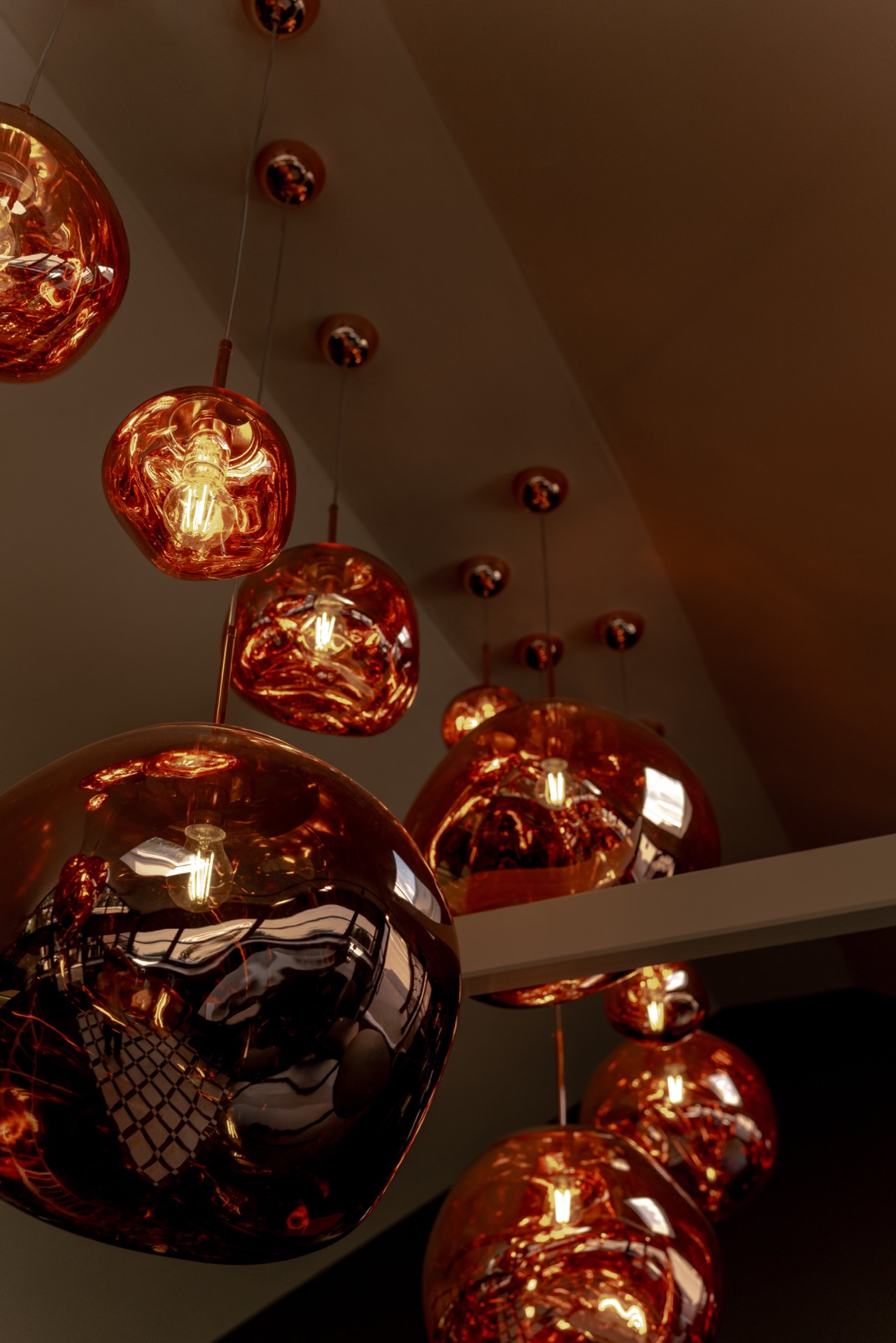 Amber glass pendant lights in the bar