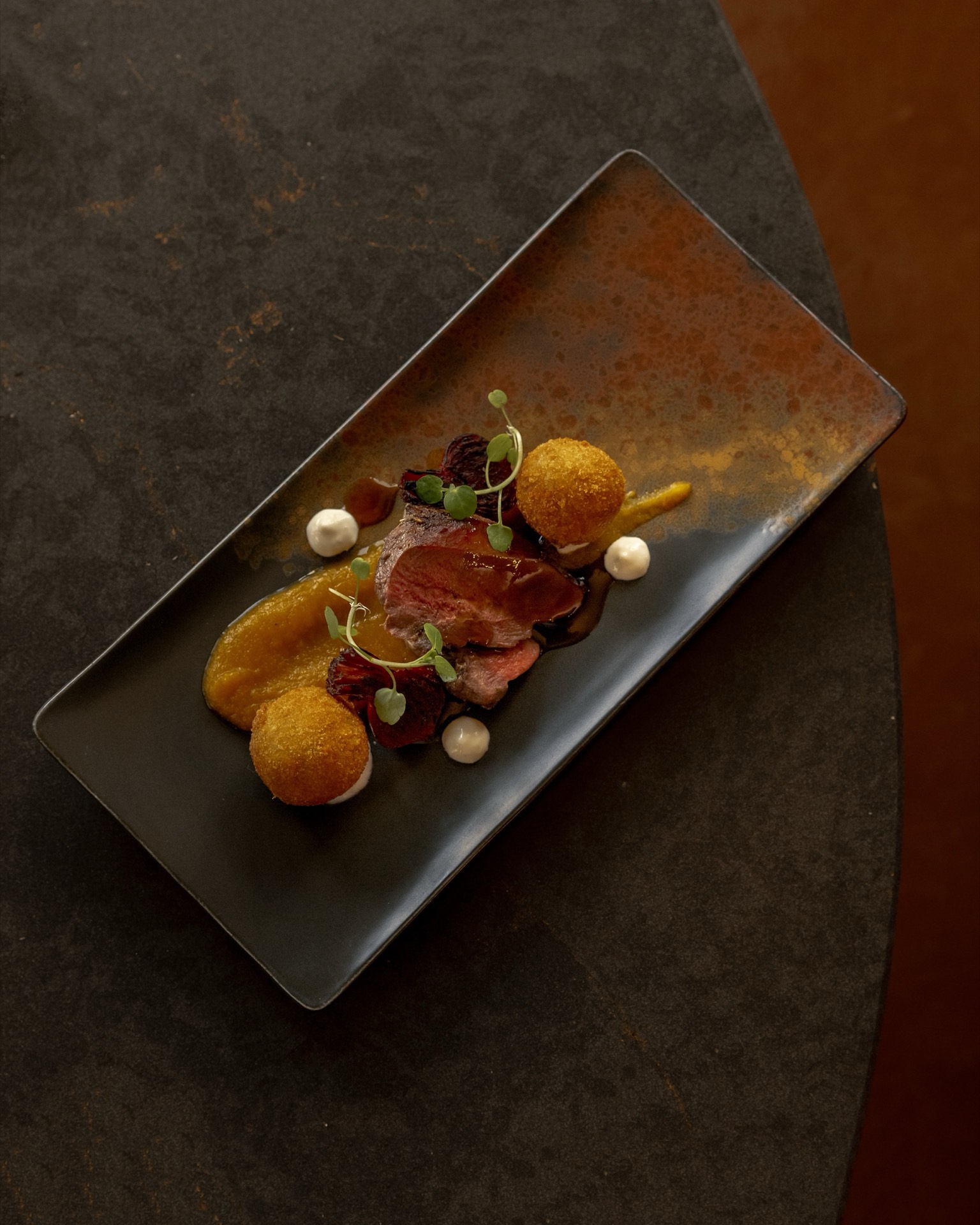 A plated meat dish at Mason's