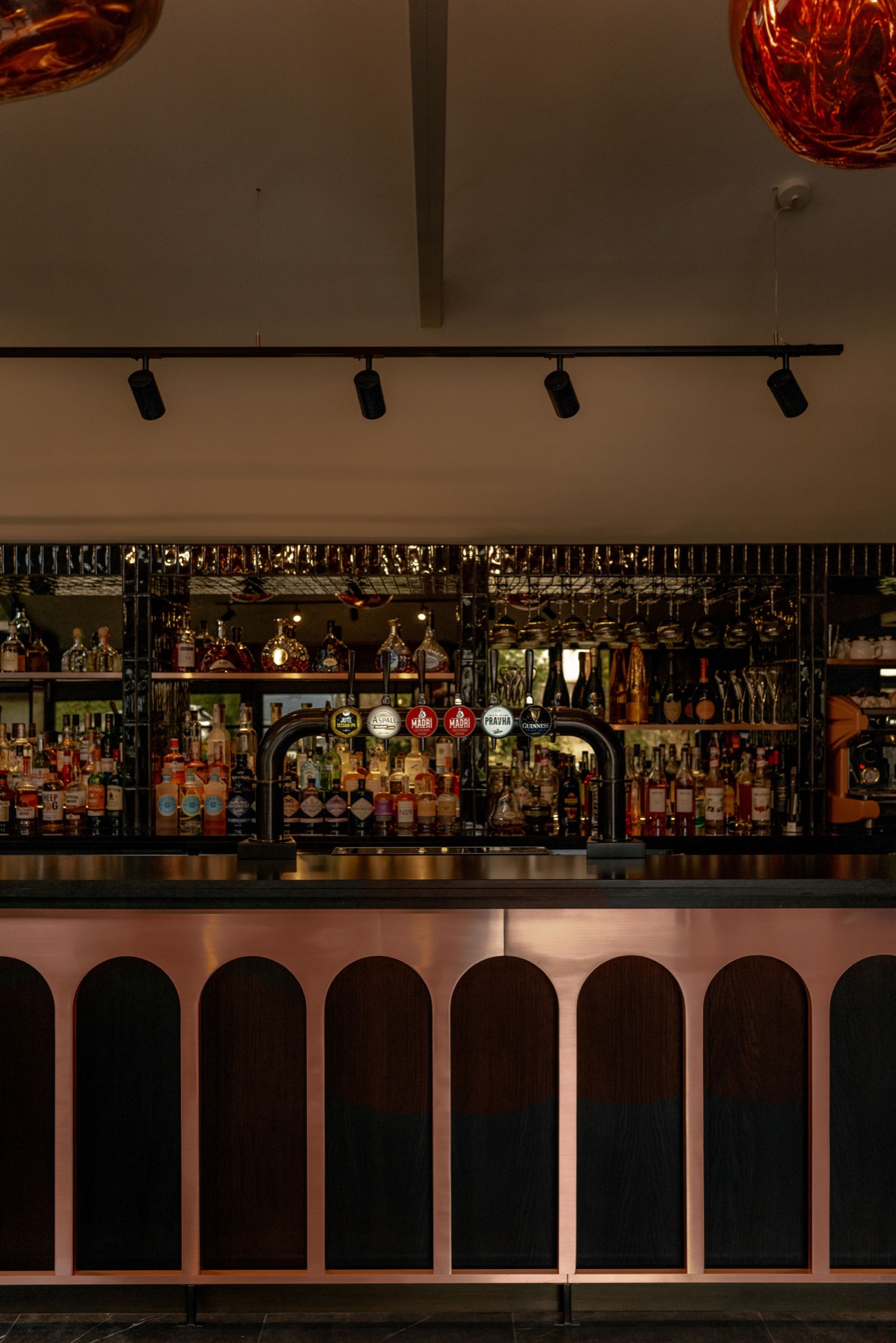 The bar with bottles and taps