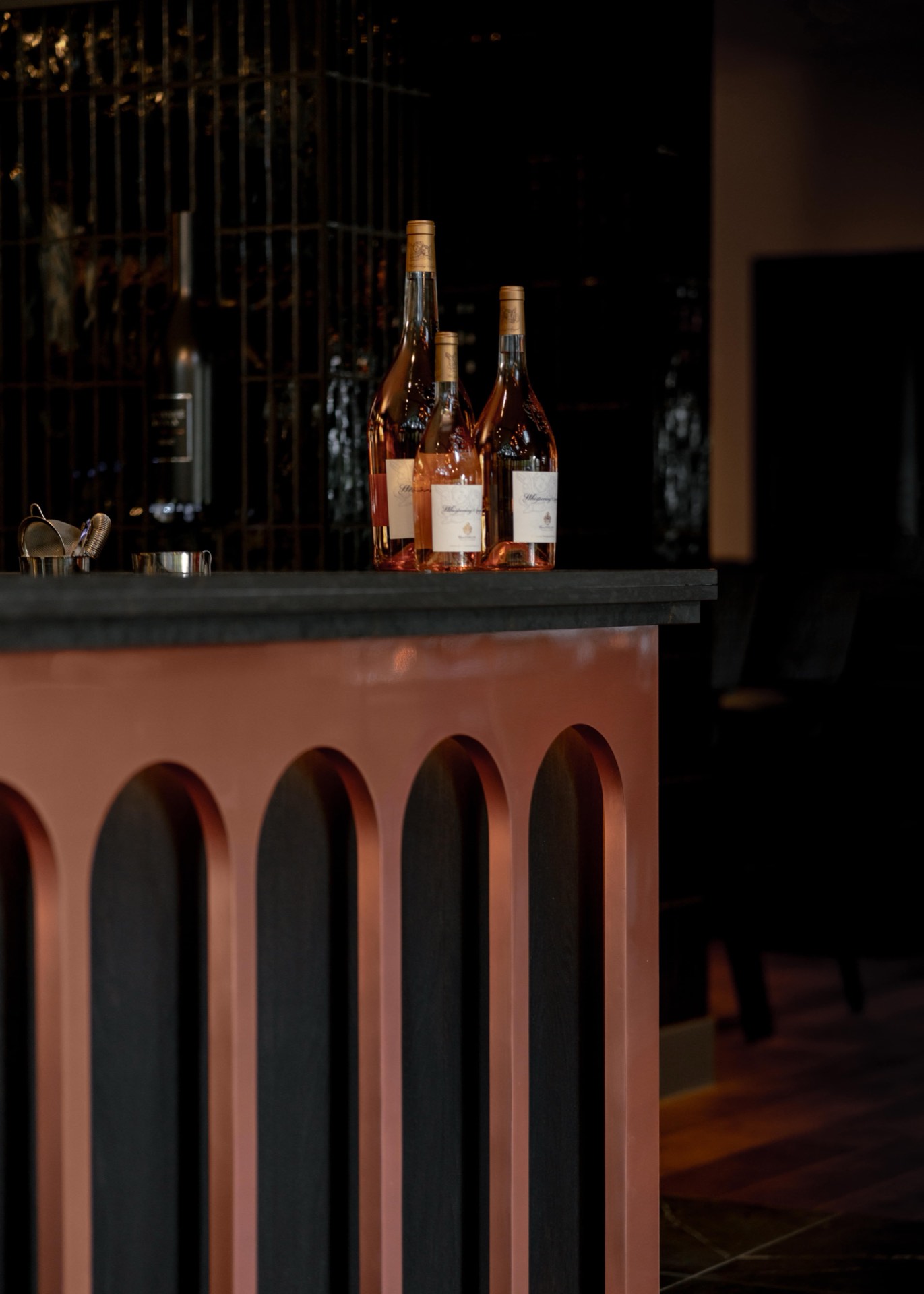 The bar at Mason's with a glass of rosé wine