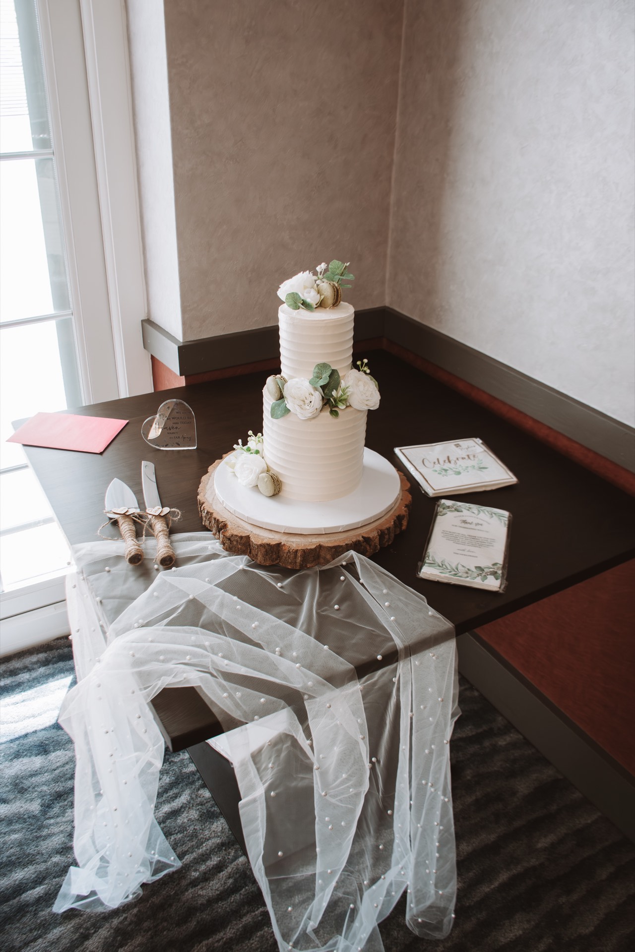 A two-tier white wedding cake